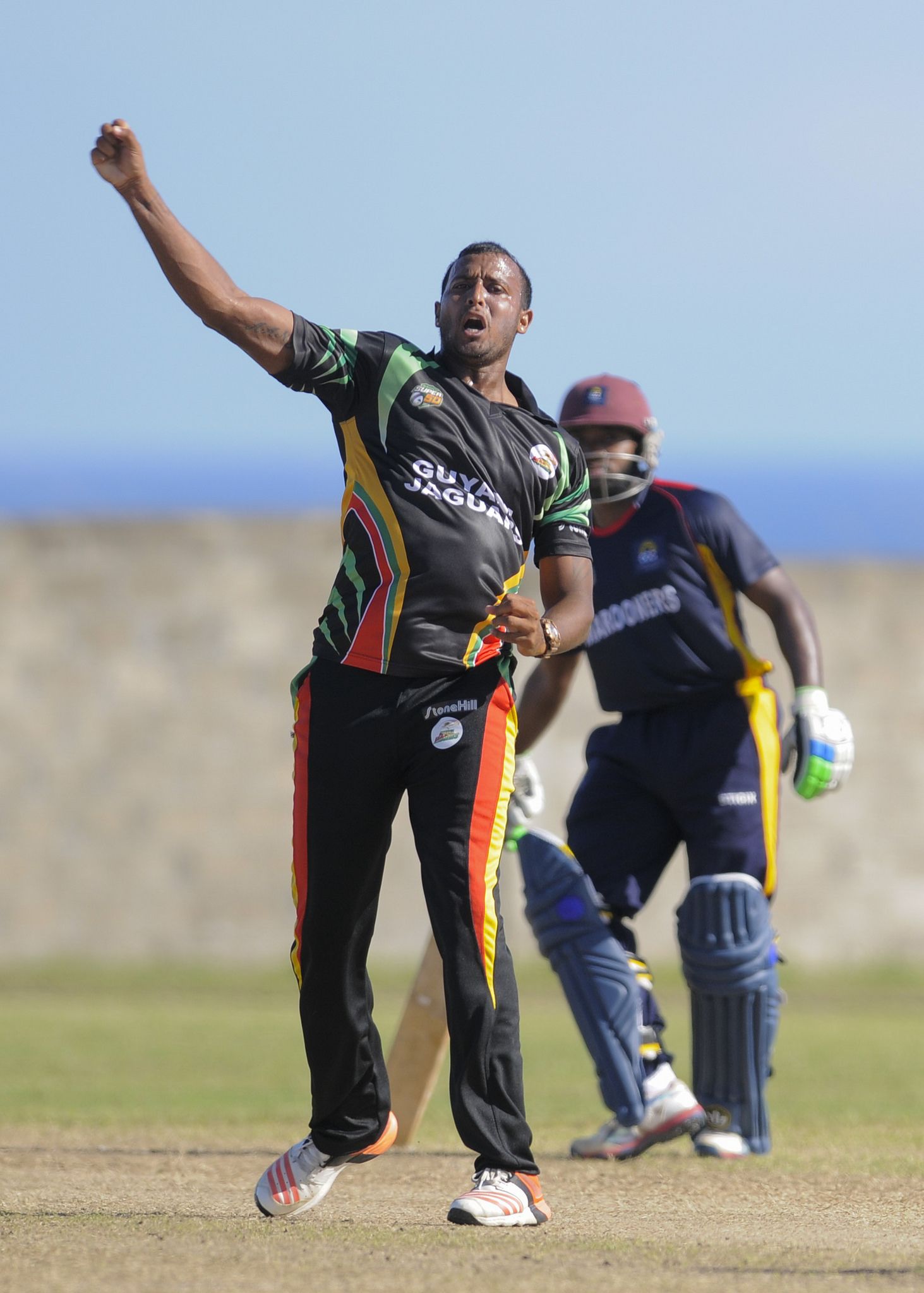 Paul Wintz celebrates one of his three wickets