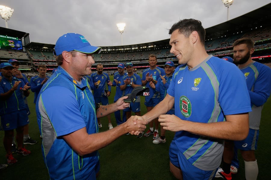 Scott Boland was handed his Australia T20I cap by Ryan Harris