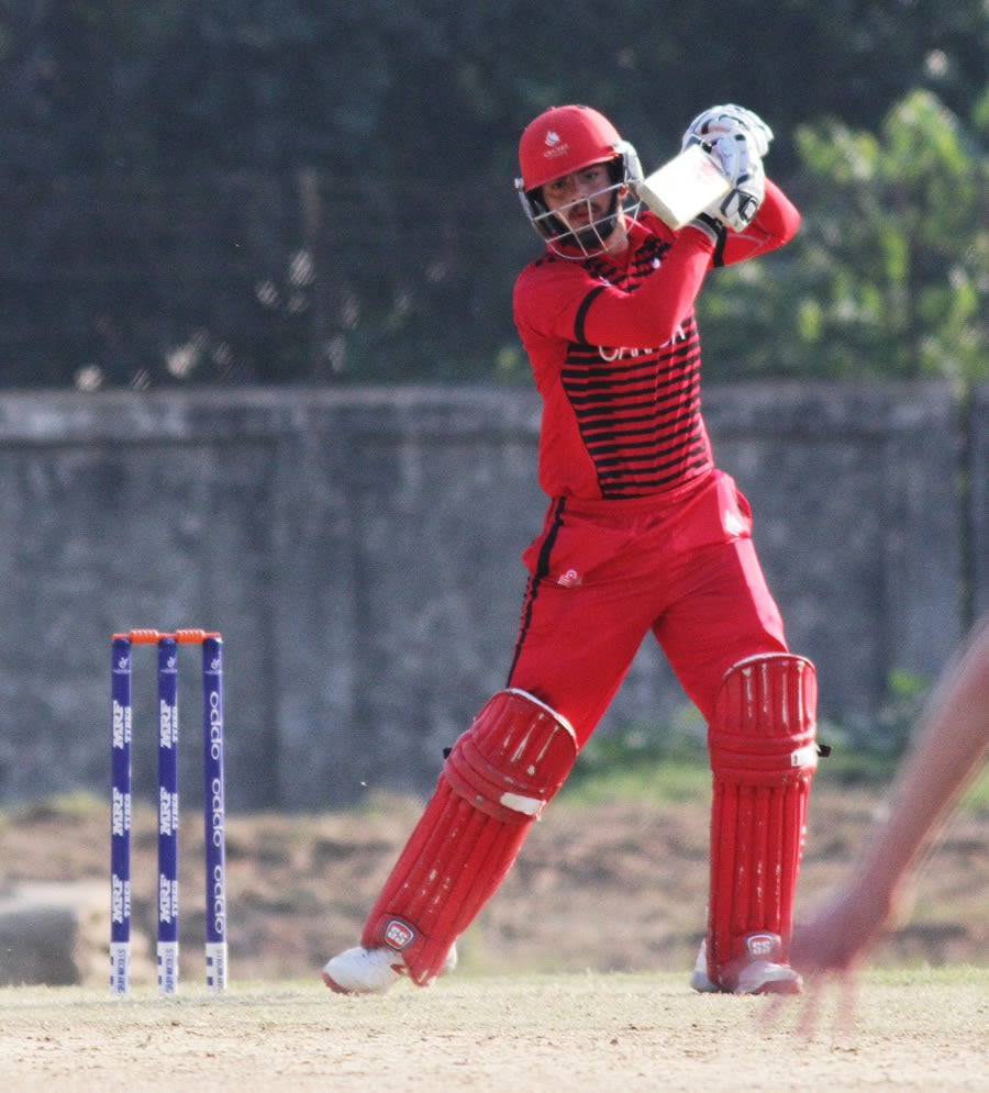 Abraash Khan punches the ball through the off side