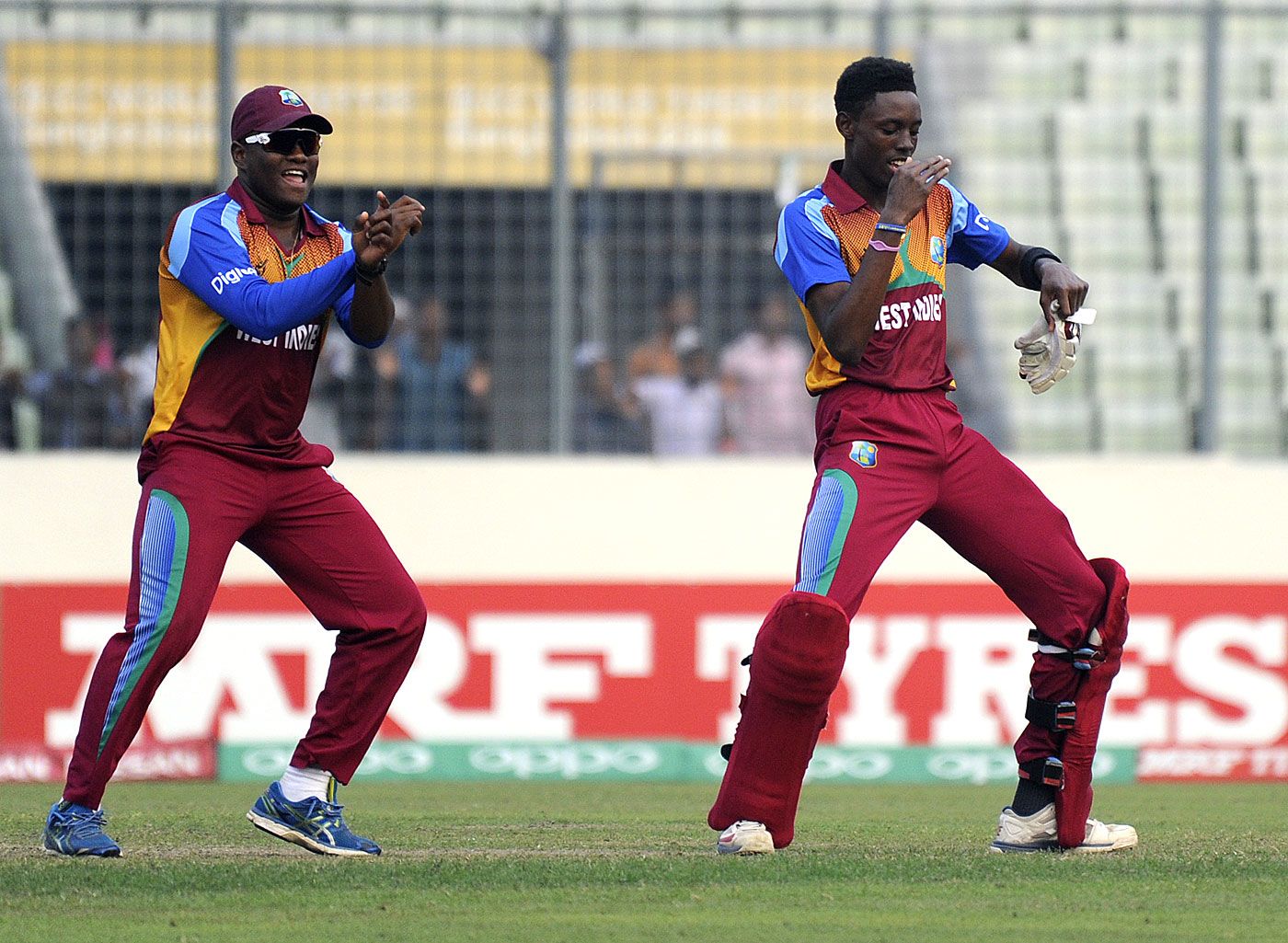 Gidron Pope and Shamar Springer celebrate after the semi-final win