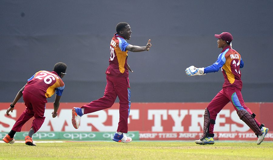 Chemar Holder celebrates after taking a wicket