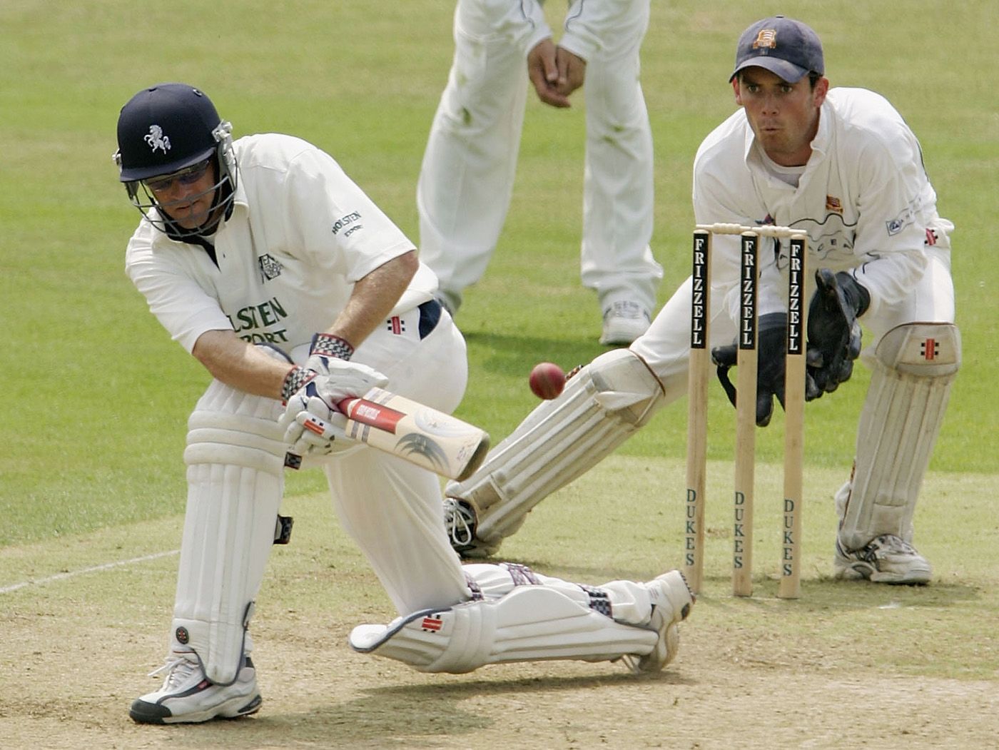Wicketkeeper James Foster watches batsman David Fulton try to sweep a ball