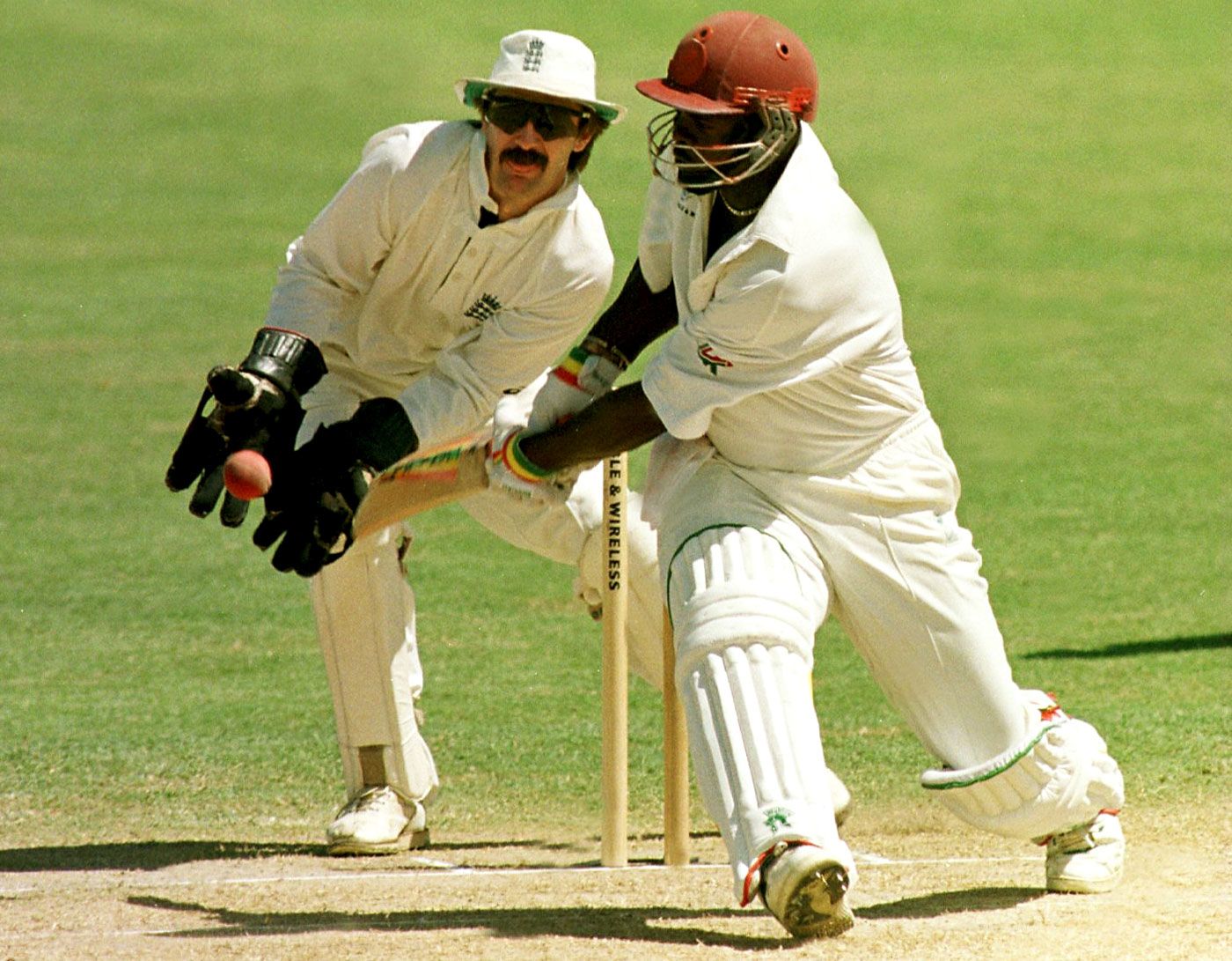 Jack Russell moves down leg side to catch the ball as Clayton Lambert tries to sweep