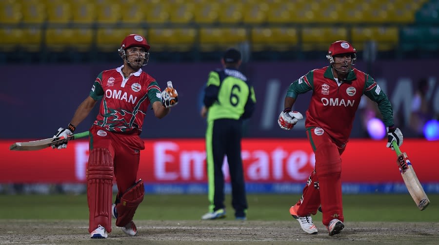 Ajay Lalcheta and Munis Ansari celebrate Oman's two-wicket win over Ireland