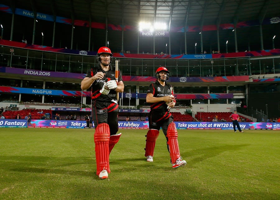 Hong Kong openers Jamie Atkinson and Ryan Campbell walk out to bat