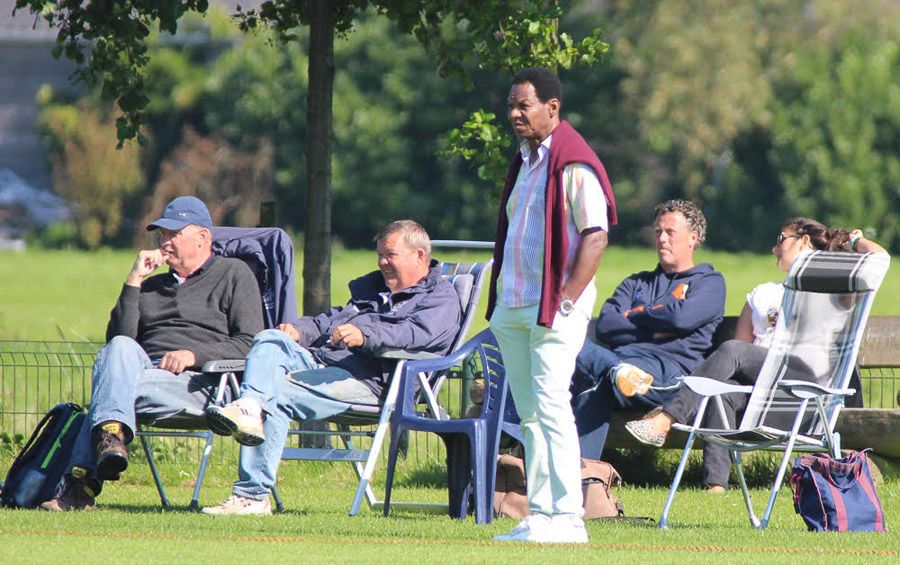 Nolan Clarke (standing) watches Netherlands play