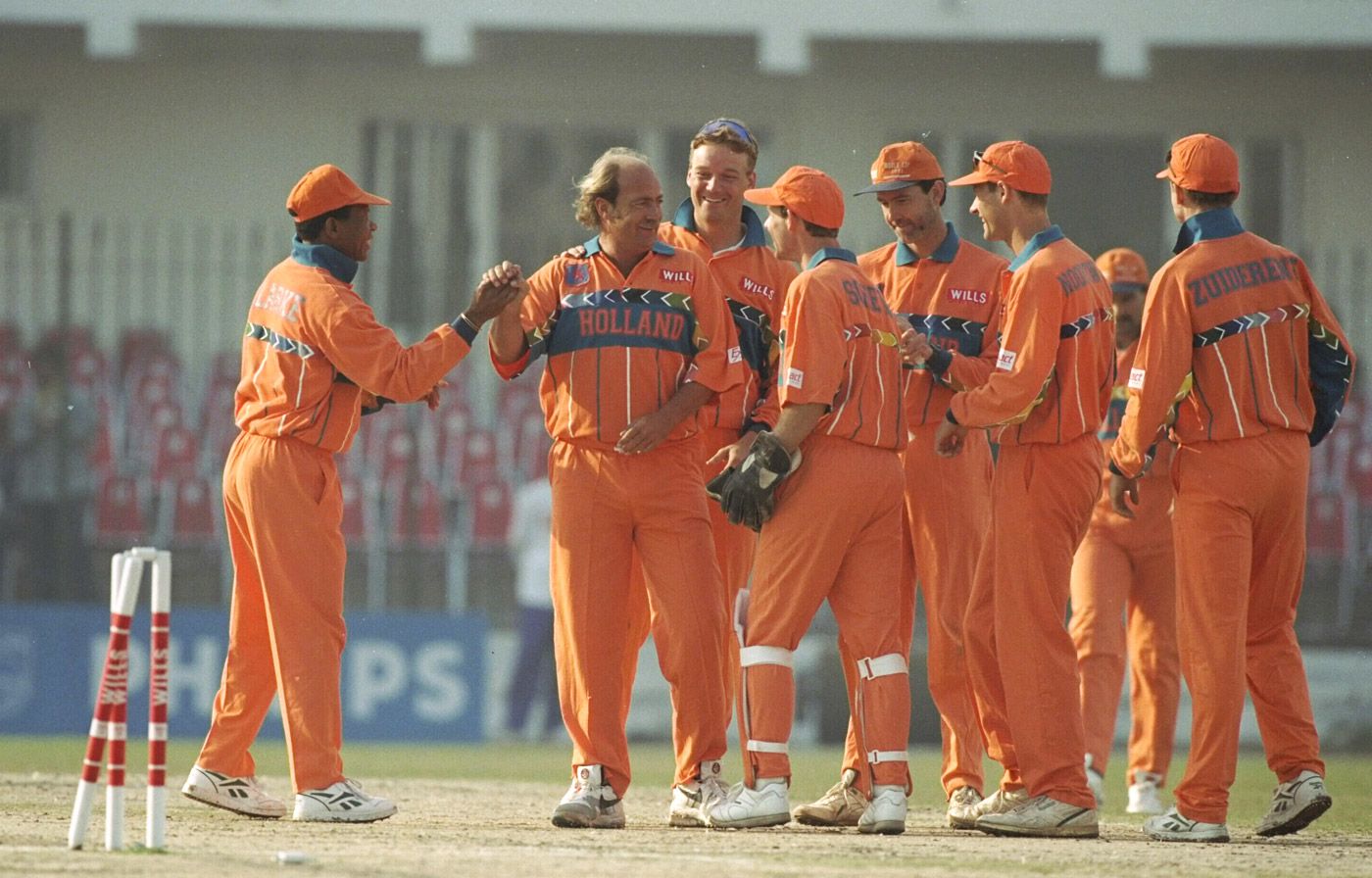 Nolan Clarke congratulates Jan Bakker for his wicket of Alec Stewart