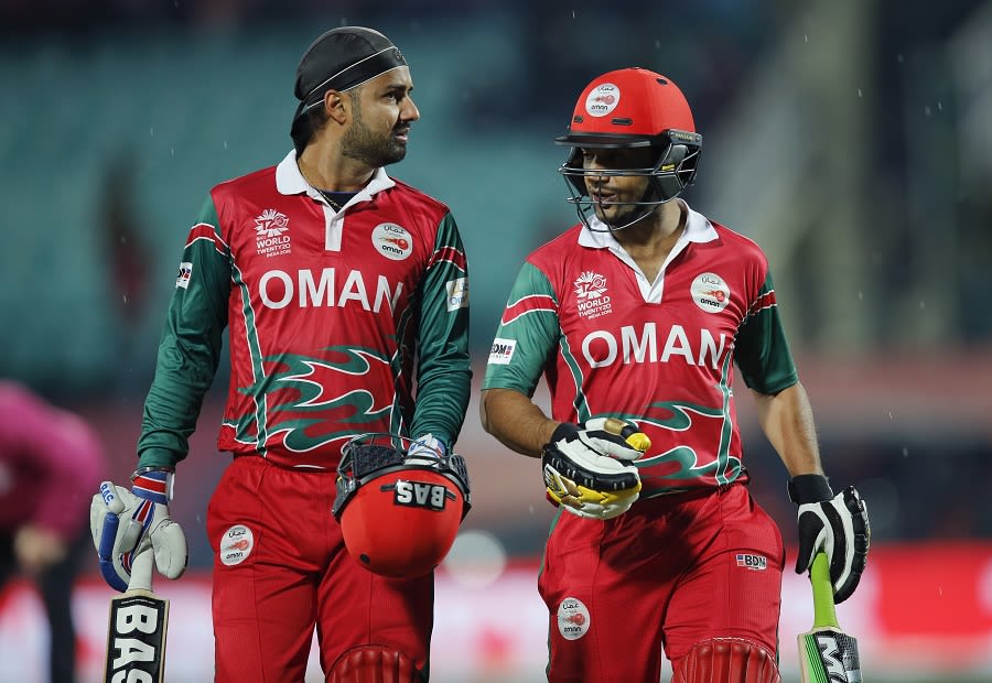 Jatinder Singh and Adnan Ilyas walk off as rain stops play