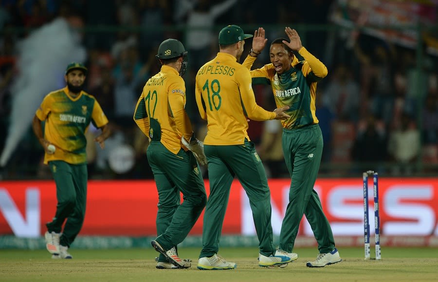 Aaron Phangiso celebrates a wicket with his team-mates