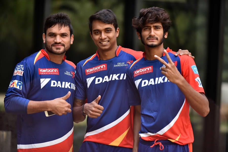 Pawan Suyal, Chama Milind and Khaleel Ahmed pose for a photograph