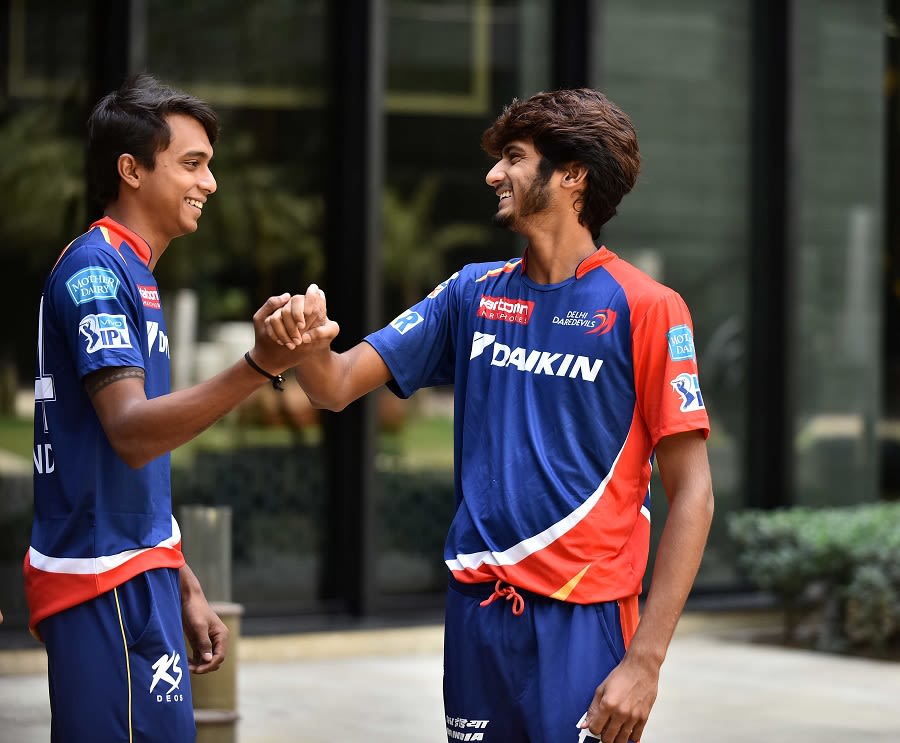 Comrades-in-arms: Chama Milind and Khaleel Ahmed share a lighter moment