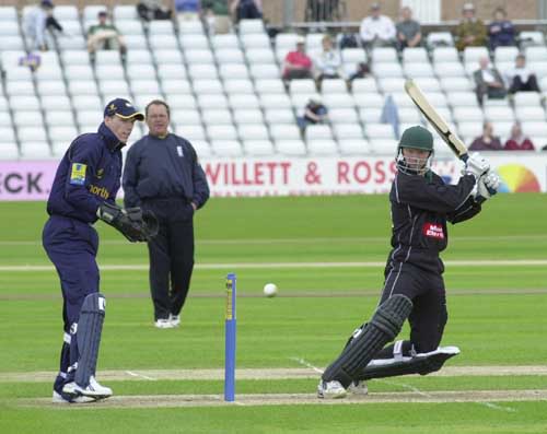 Gareth Batty cuts Graeme Bridge as Andrew Pratt looks on