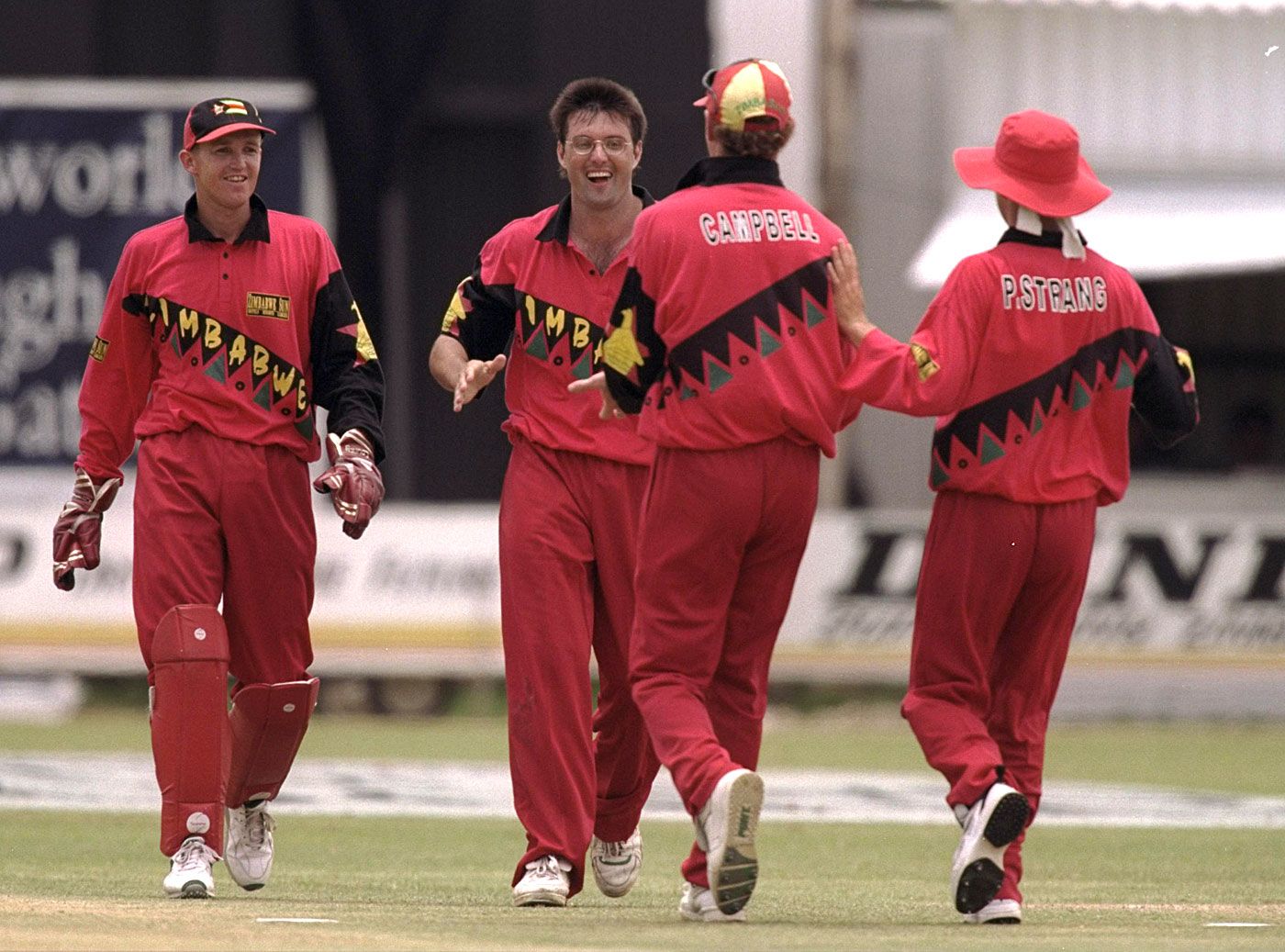 Andy Flower, John Rennie, Alistair Campbell and Paul Strang celebrate