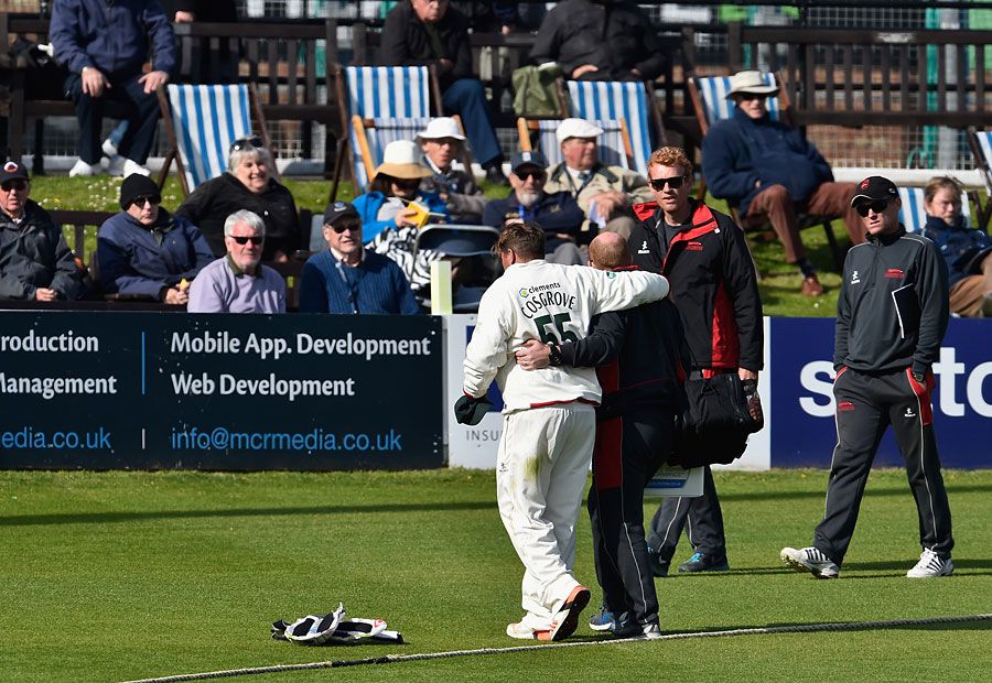 Mark Cosgrove is helped off the field
