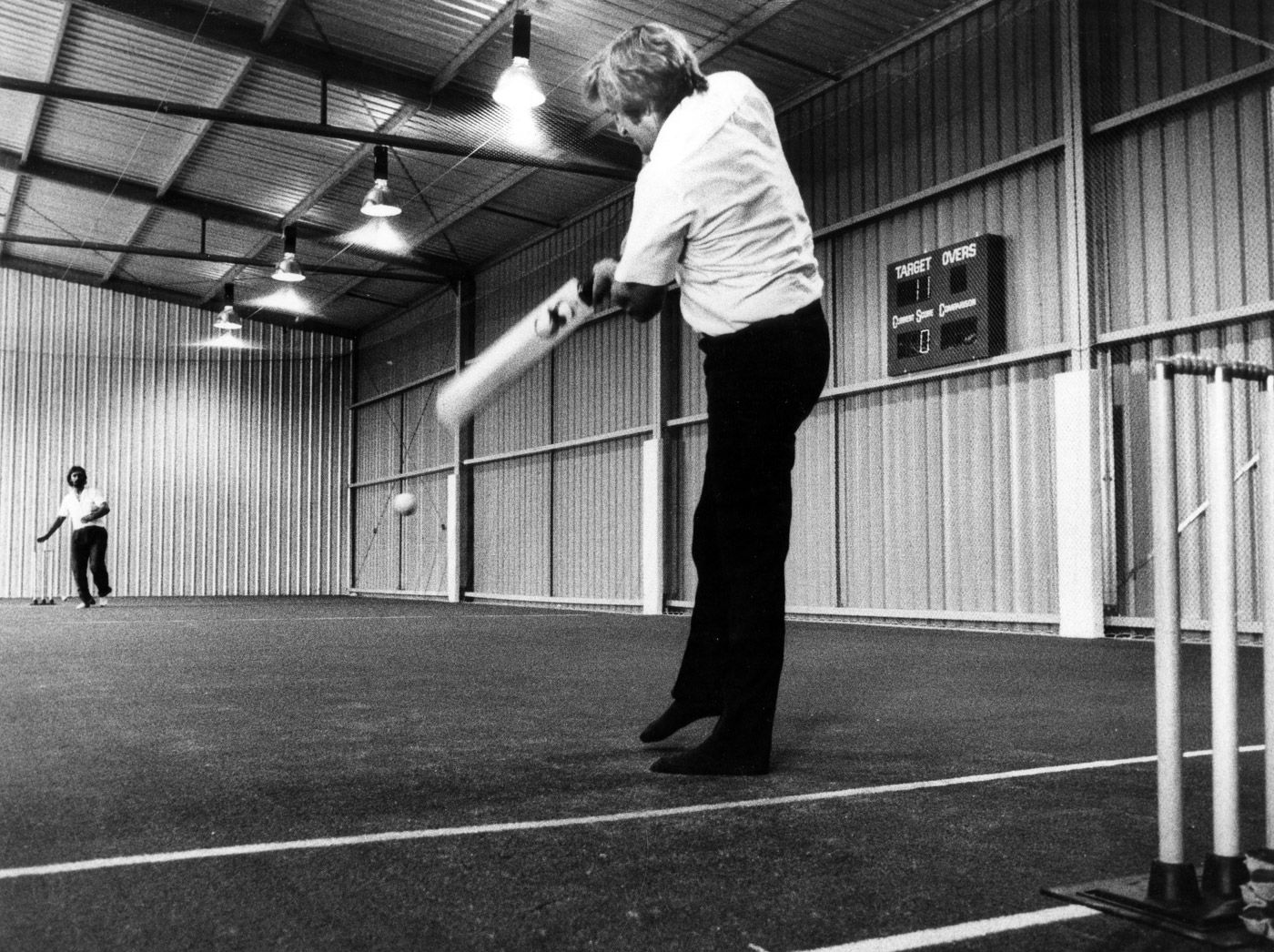 Gary Gilmour tries out the wicket at the new Cardiff Indoor Cricket centre