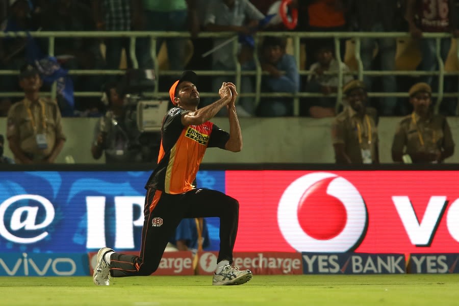 Barinder Sran takes a catch to dismiss Kieron Pollard