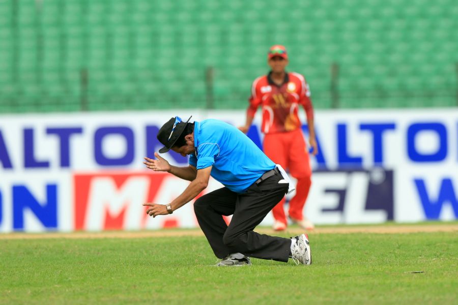 Umpire Nadir Shah collapses after being hit on the forehead