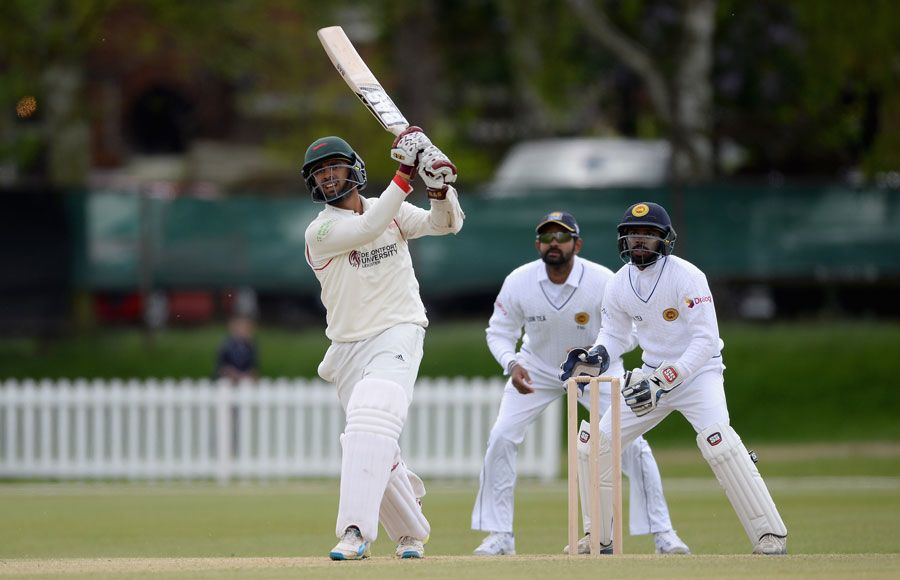 Aadil Ali hits down the ground during his 46