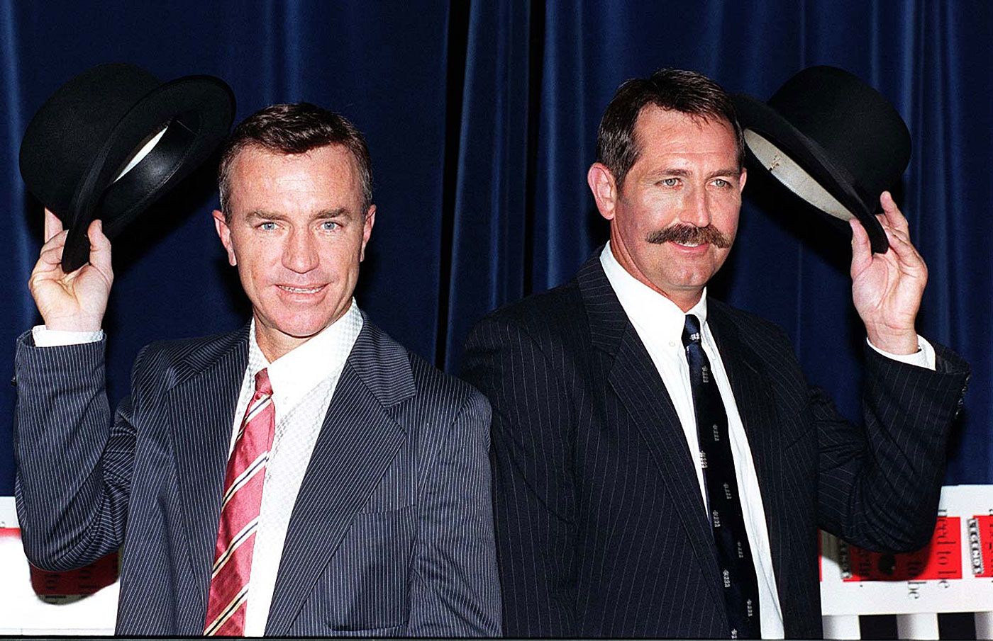 Greg Matthews and Graham Gooch take their hats off at an event for Advanced Hair Studio