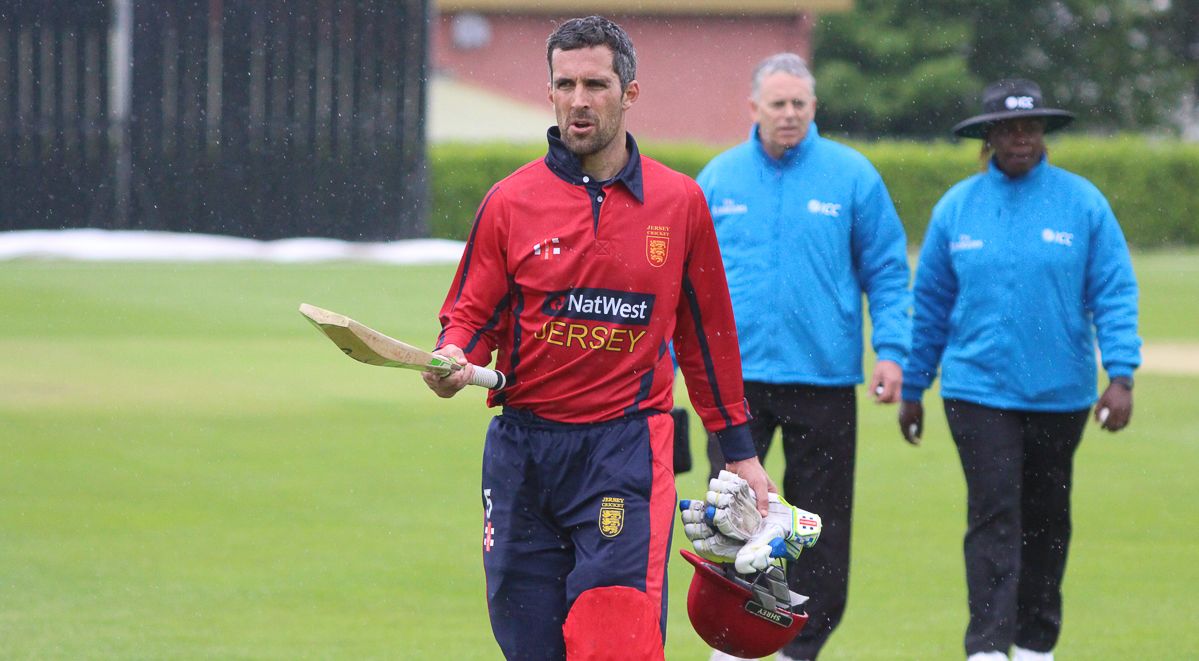 Captain Peter Gough walks off after rain forced play to stop with no result