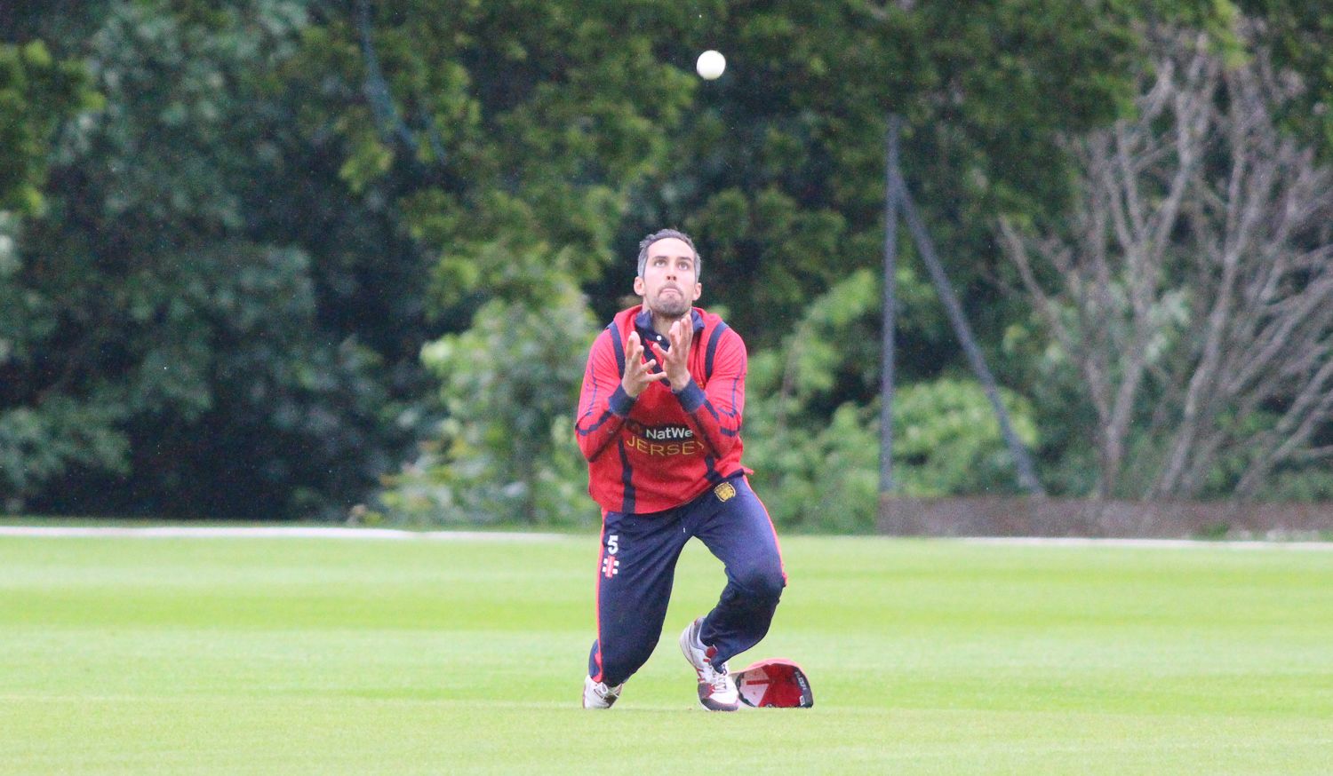 Peter Gough dives forward at midwicket to take a catch dismissing Rajeshkumar Ranpura