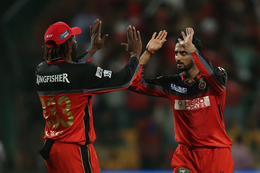 S Aravind celebrates one of his two wickets with Chris Gayle