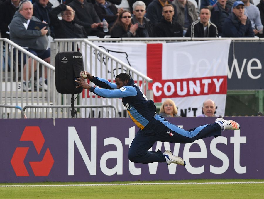Chesney Hughes dives full-length for a catch