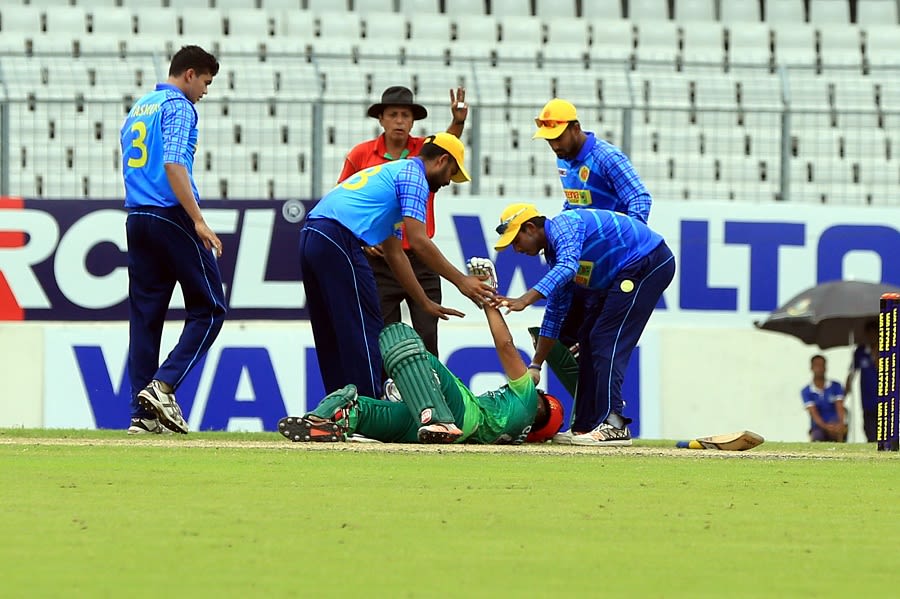 Suhrawadi Shuvo is attended to after being struck by a bouncer