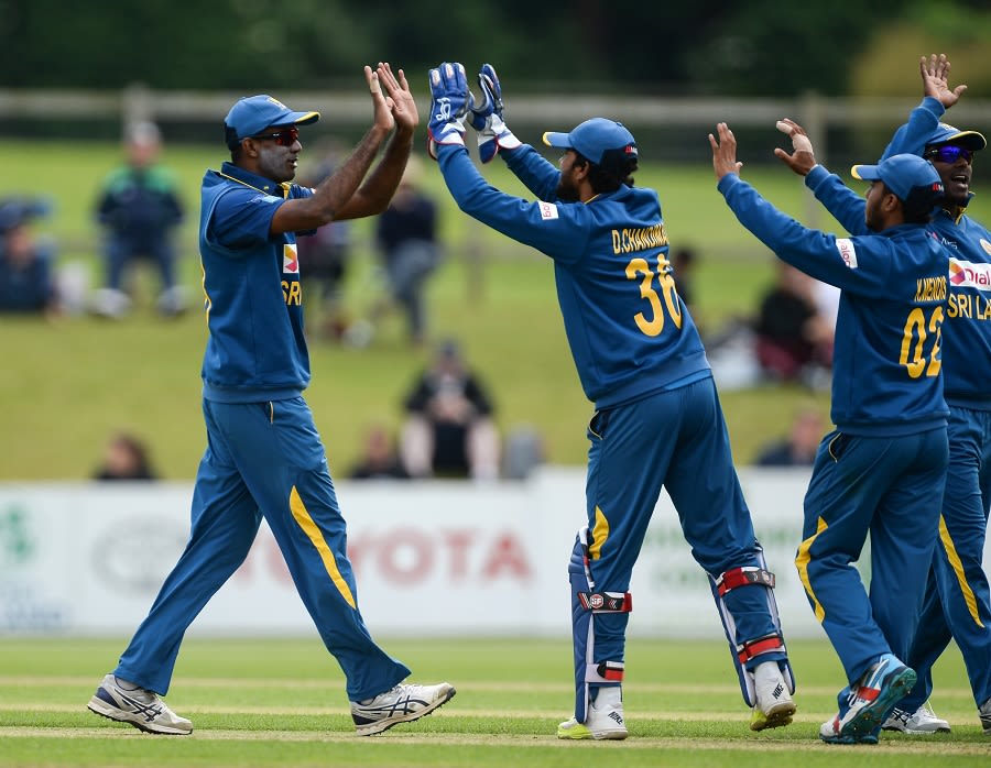 Farveez Maharoof is congratulated by his team-mates