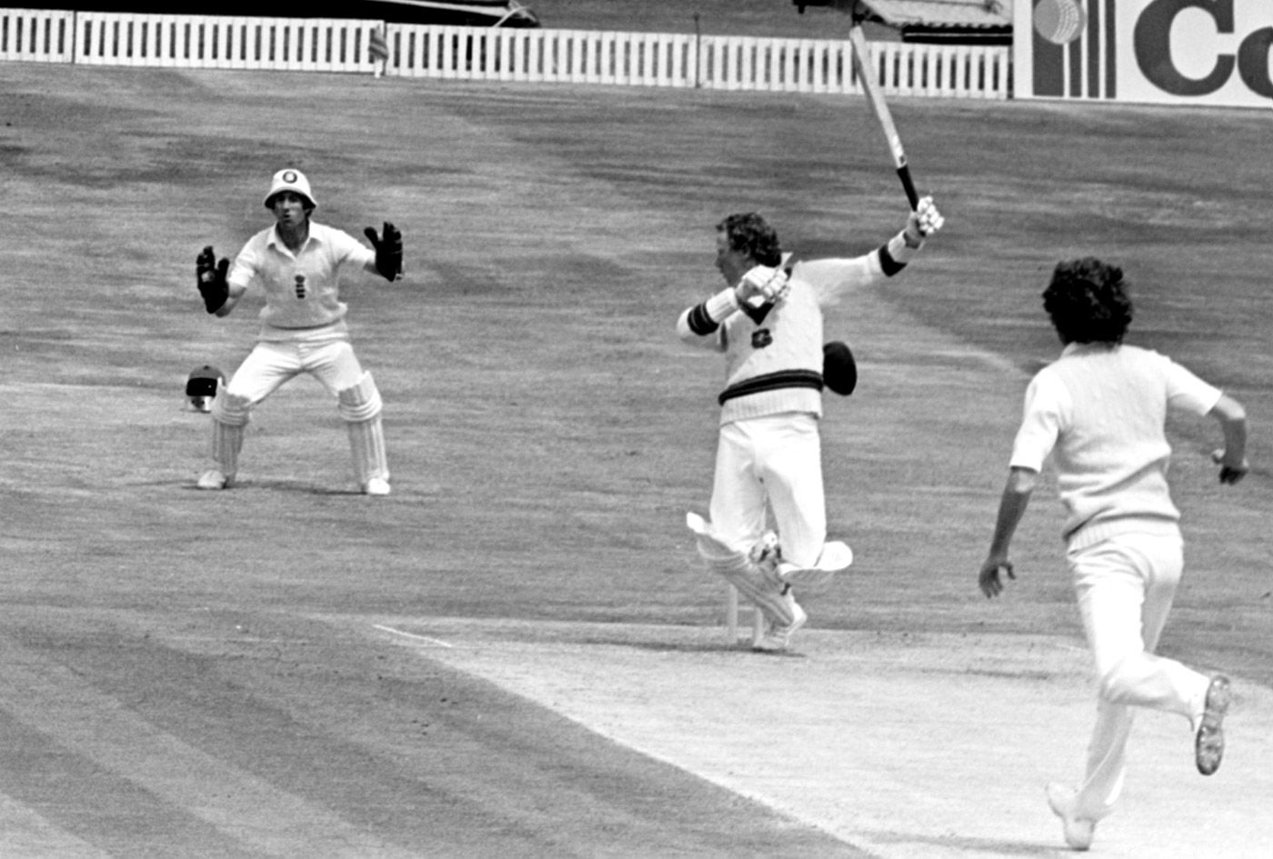 Kim Hughes loses his cap while trying to deal with a short ball from Bob Willis