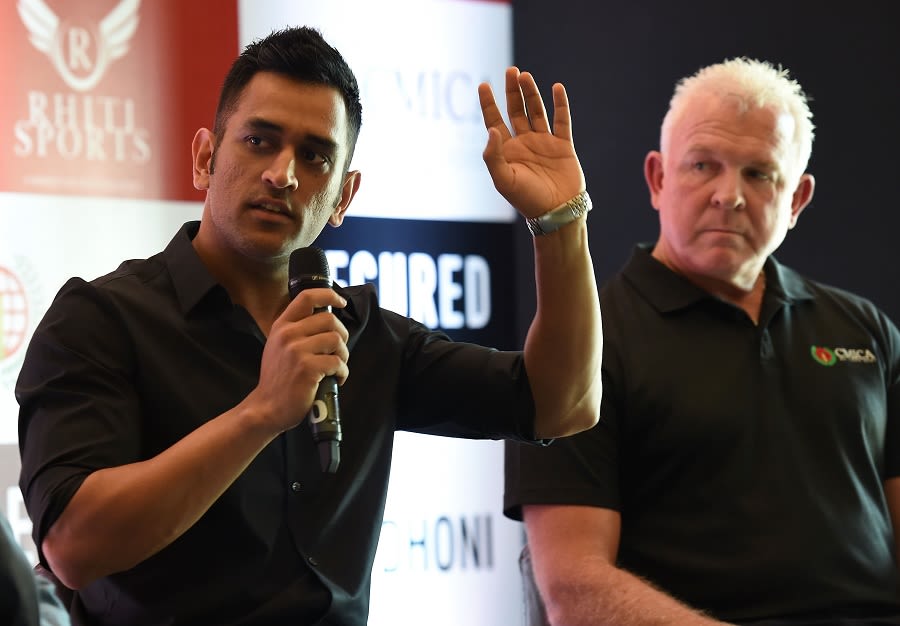 MS Dhoni with Craig McDermott at a promotional event in Delhi