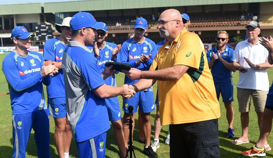 Jon Holland receives his baggy green from Merv Hughes