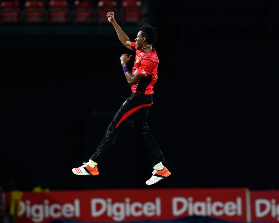 Ronsford Beaton takes flight after one of his three wickets