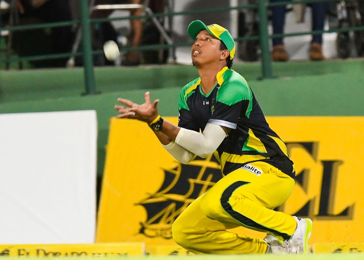 Jonathan Foo takes a catch on the boundary to remove Sohail Tanvir