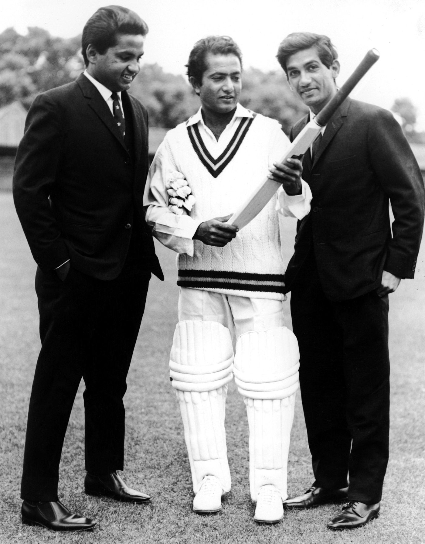 Hanif, Mushtaq and Sadiq Mohammad inspect a bat