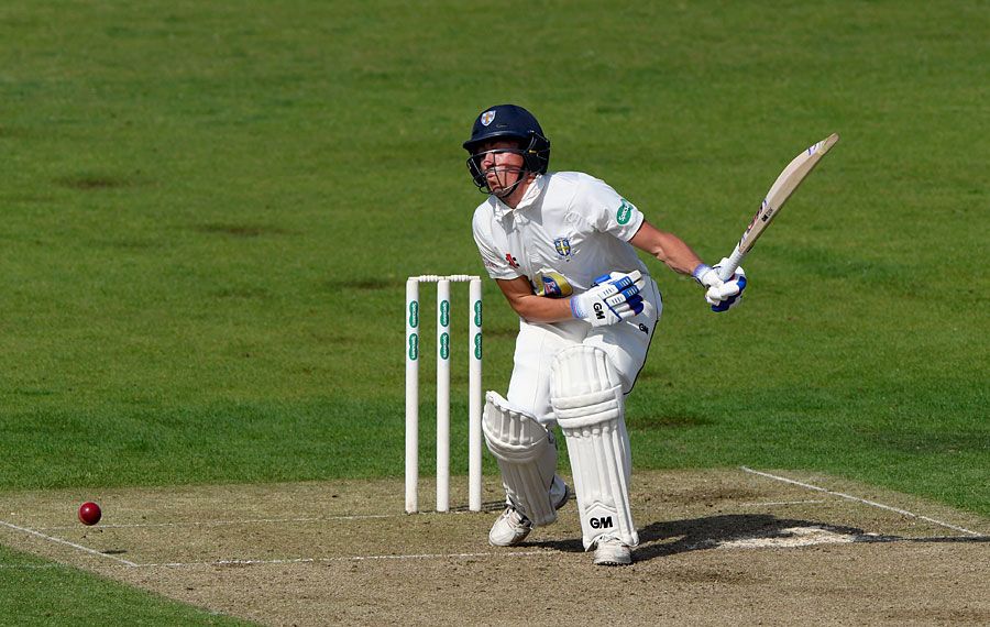 Michael Richardson takes a blow during his half-century
