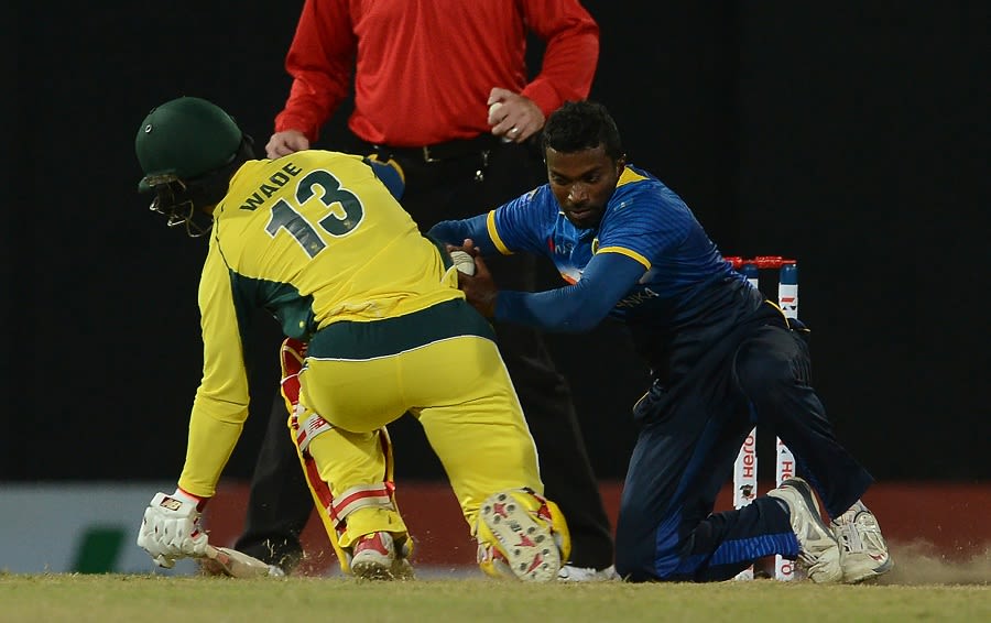 Matthew Wade collides with Amila Aponso