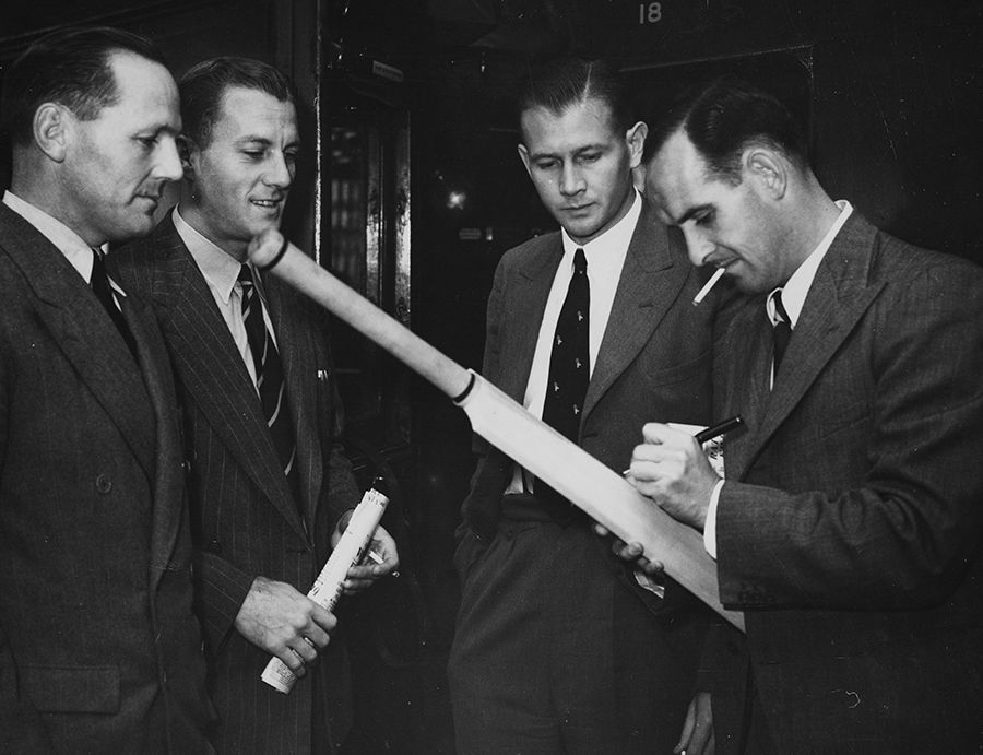 South Africa cricketers (L-R) Ken Viljoen, Athol Rowan, Lindsay Tuckett and Jack Plimsoll sign a bat