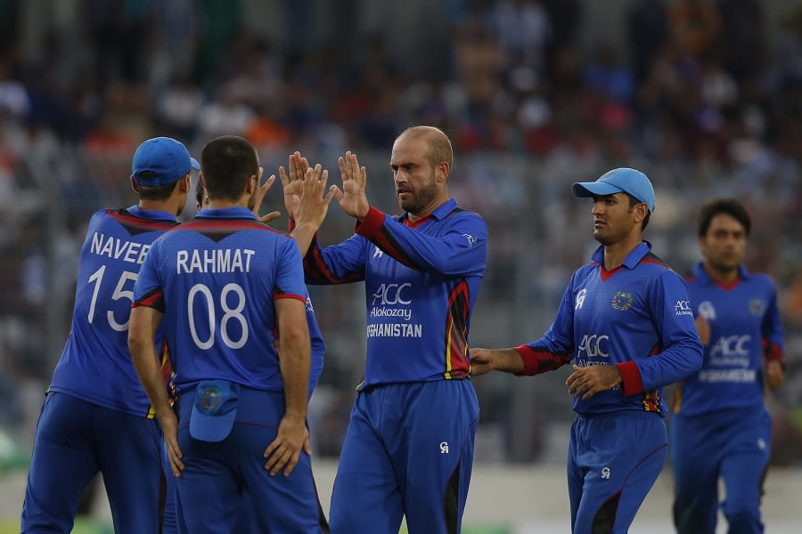 Mirwais Ashraf is mobbed by his team-mates