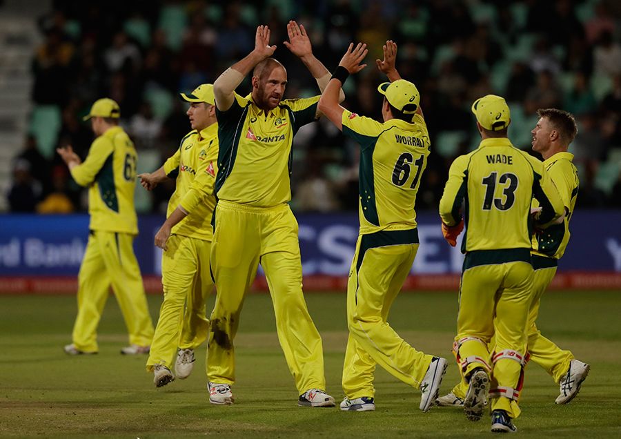 John Hastings celebrates with team-mates after dismissing Hashim Amla