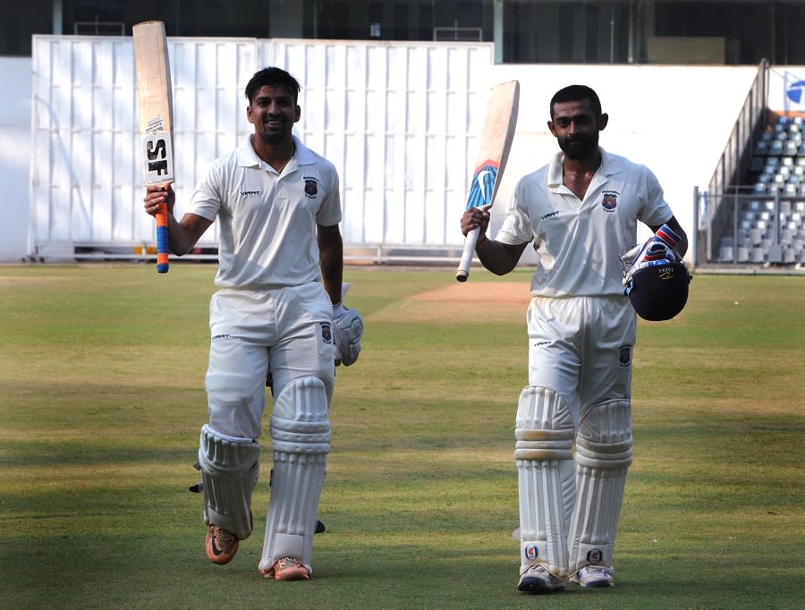 Swapnil Gugale and Ankit Bawne walk off after their record-breaking partnership