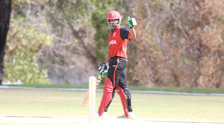 Nikhil Dutta gives a thumbs up upon reaching 50