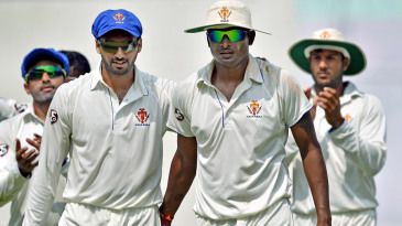 Aravind four-for helps Karnataka top South Zone