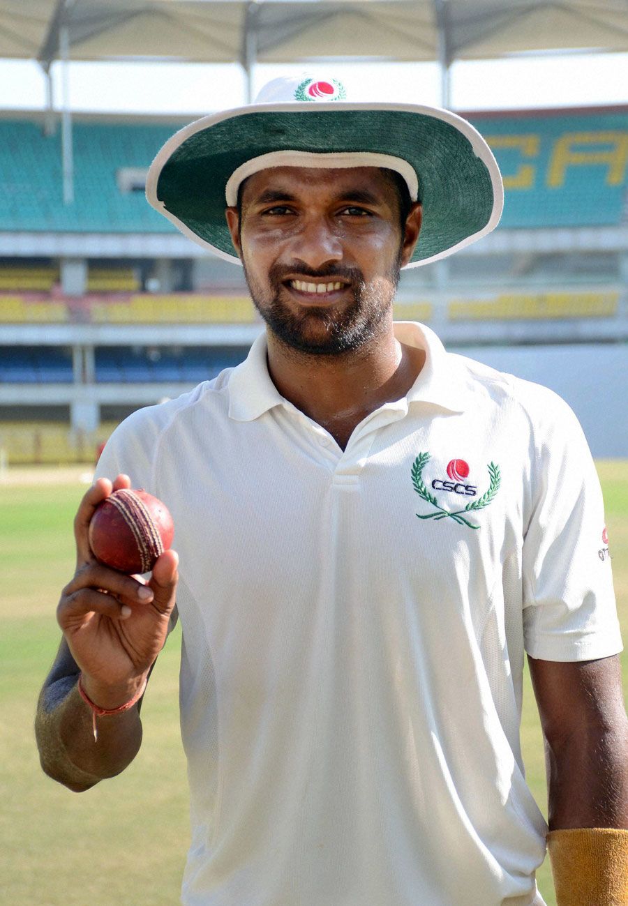 Chhattisgarh's Pankaj Rao with the match ball after claiming a five-for against Haryana