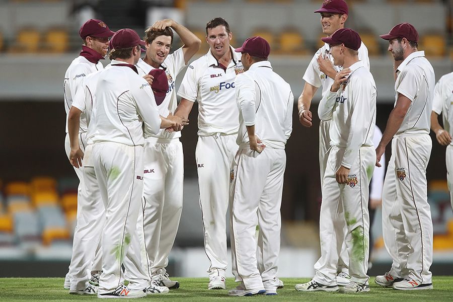 Luke Feldman celebrates one of his five wickets on the day