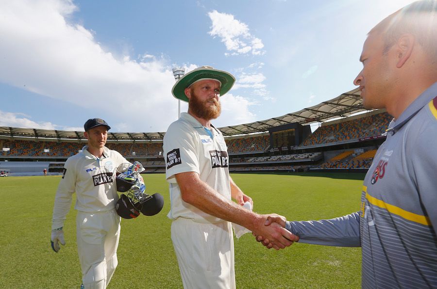 Doug Bollinger shakes hands with Usman Khawaja