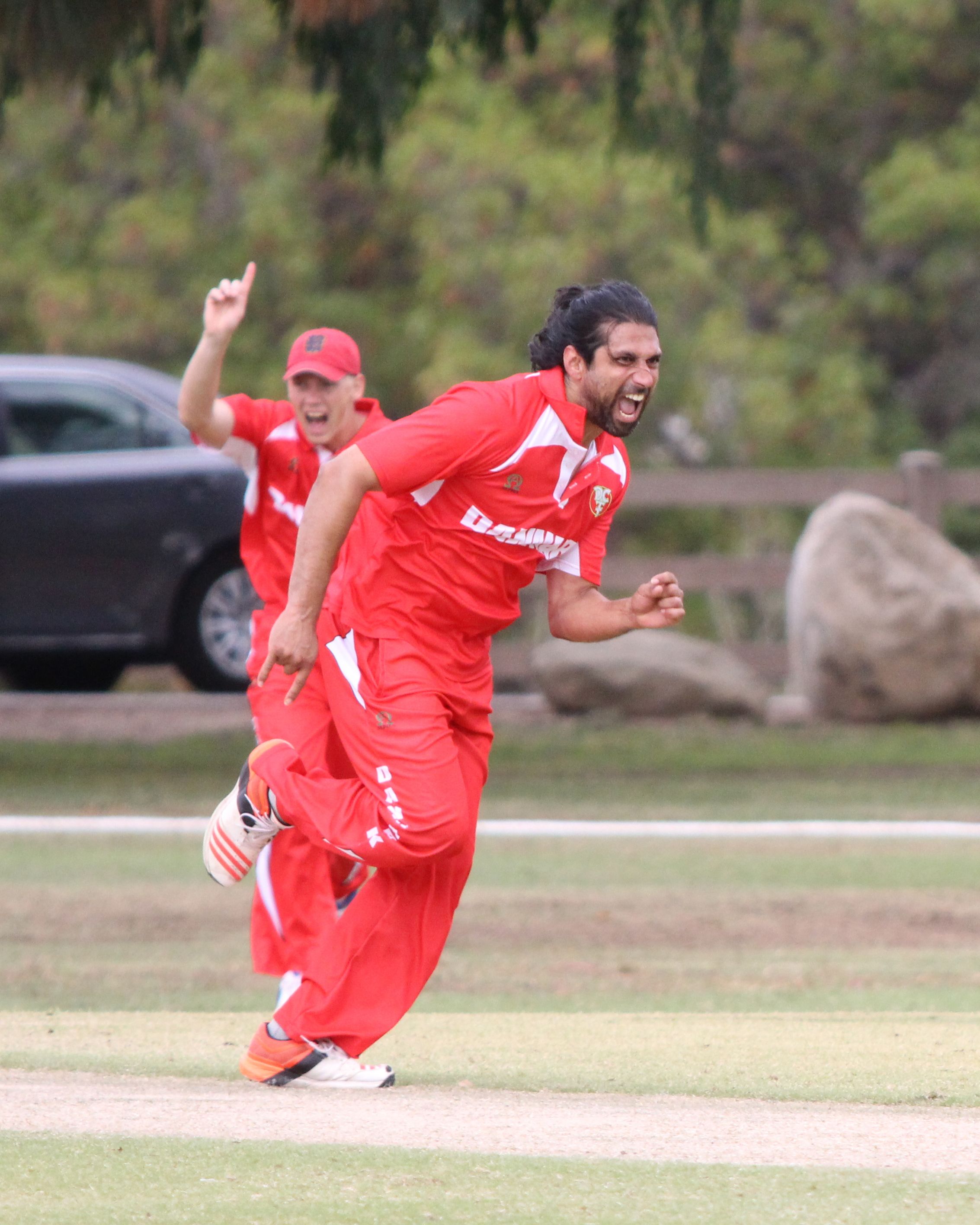 Amjad Khan celebrates the wicket of Manpreet Singh