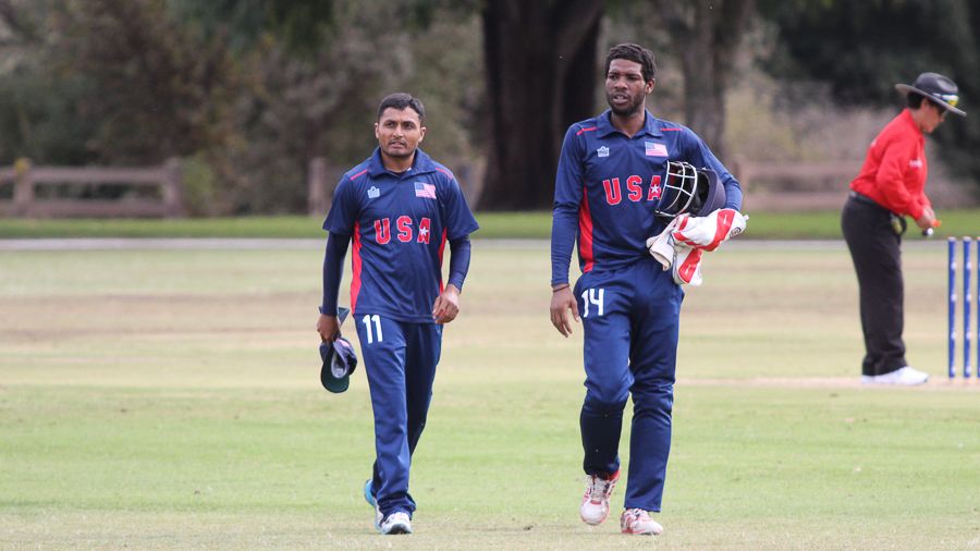 Timil Patel walks off with Akeem Dodson after taking 5 for 29