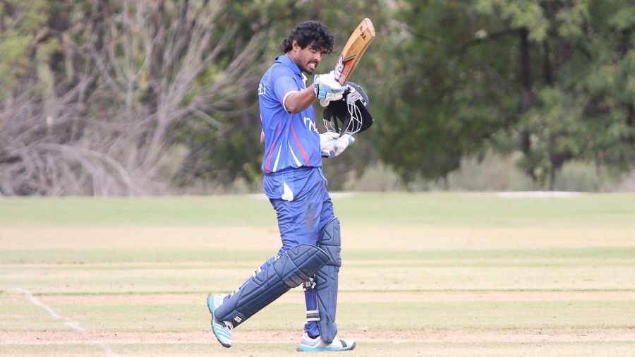 Supun Tharanga acknowledges the Italy bench after his half-century