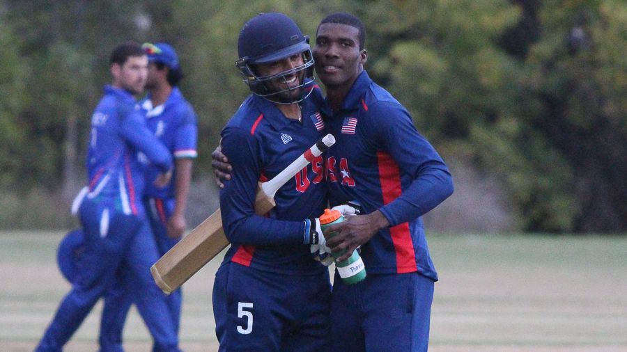Danial Ahmed gets a hug from Timroy Allen after hitting the winning run